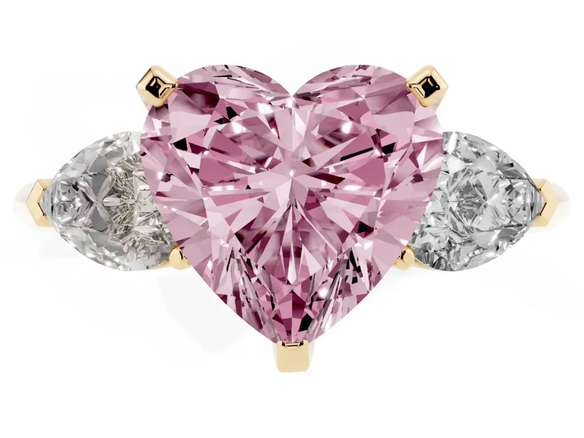 Fancy Pink Three-Stone Heart Cut Diamond Ring with Pear Side Stones and Four-Prong Setting Yellow gold
