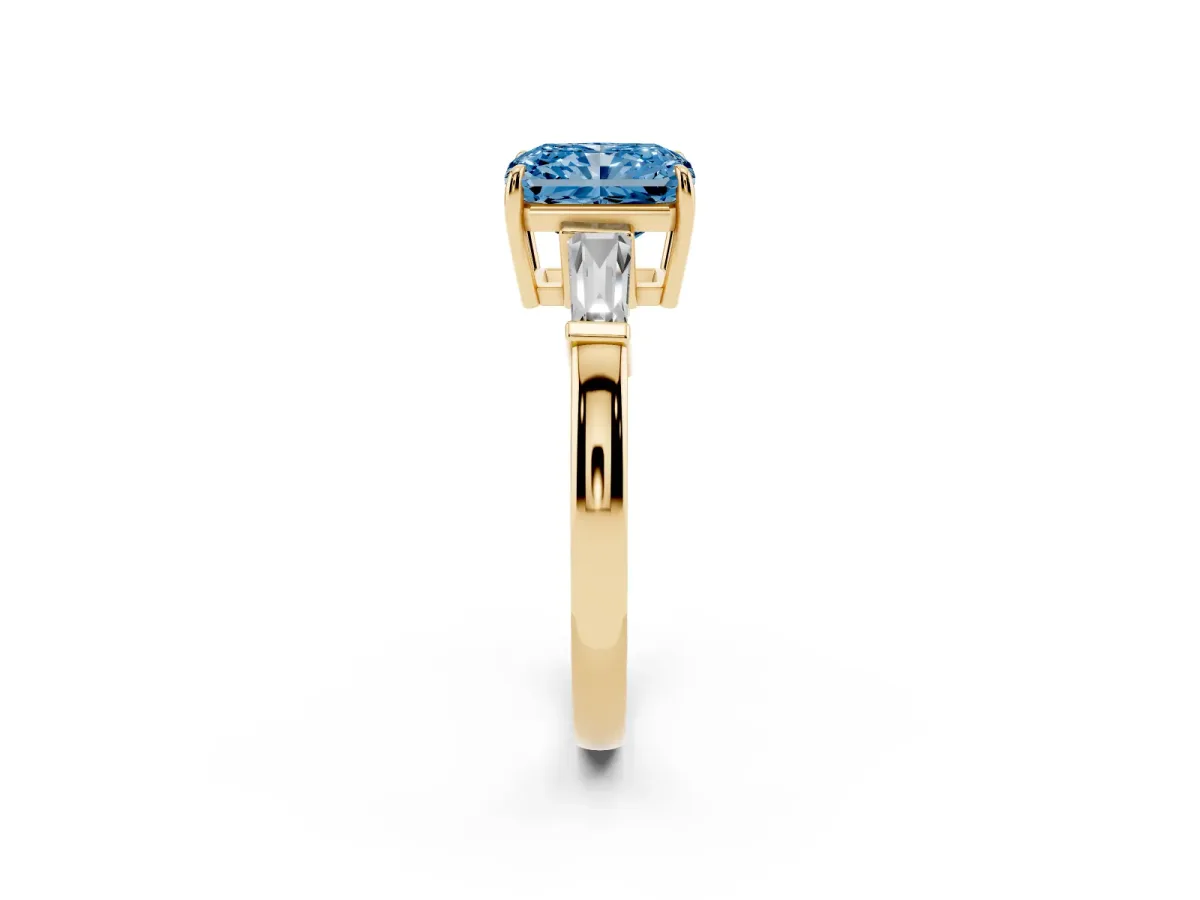 Fancy Blue Radiant Cut Diamond Three-Stone Ring with Tapered Baguette Side Stones and Prong Setting Yellow gold