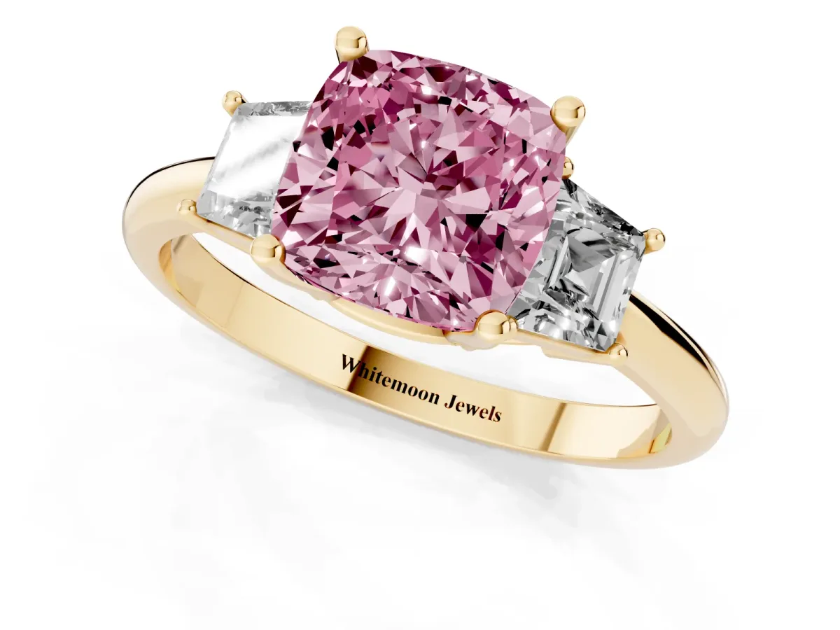 Fancy Pink Cushion Cut Diamond Three-Stone Ring with Trapezoid Side Stones and Prong Setting Yellow gold