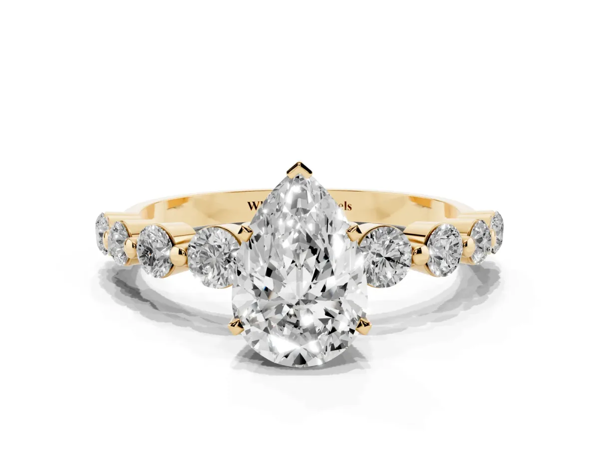Pear Cut Solitaire Diamond Ring with Pave Band and Four-Prong Setting Yellow gold