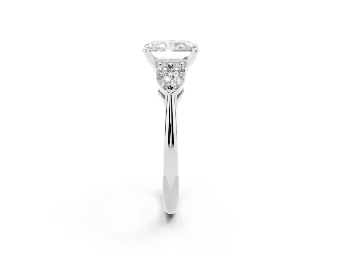 Three-Stone Radiant Cut Diamond Ring with Pear Side Stones and Four-Prong Setting Platinum