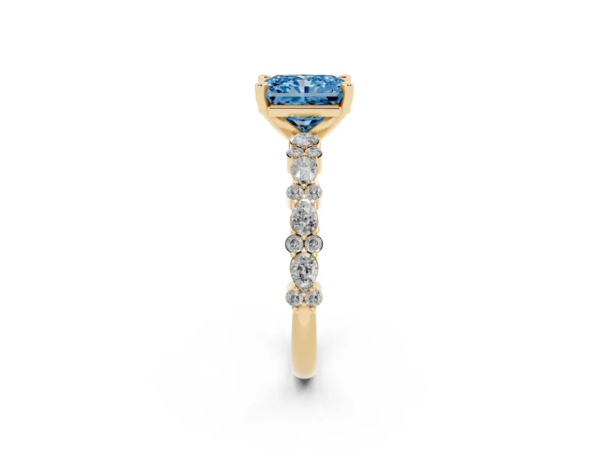 Fancy Blue Radiant Cut Diamond Side Stone Solitaire Ring with Round and Four-Prong Setting Yellow gold