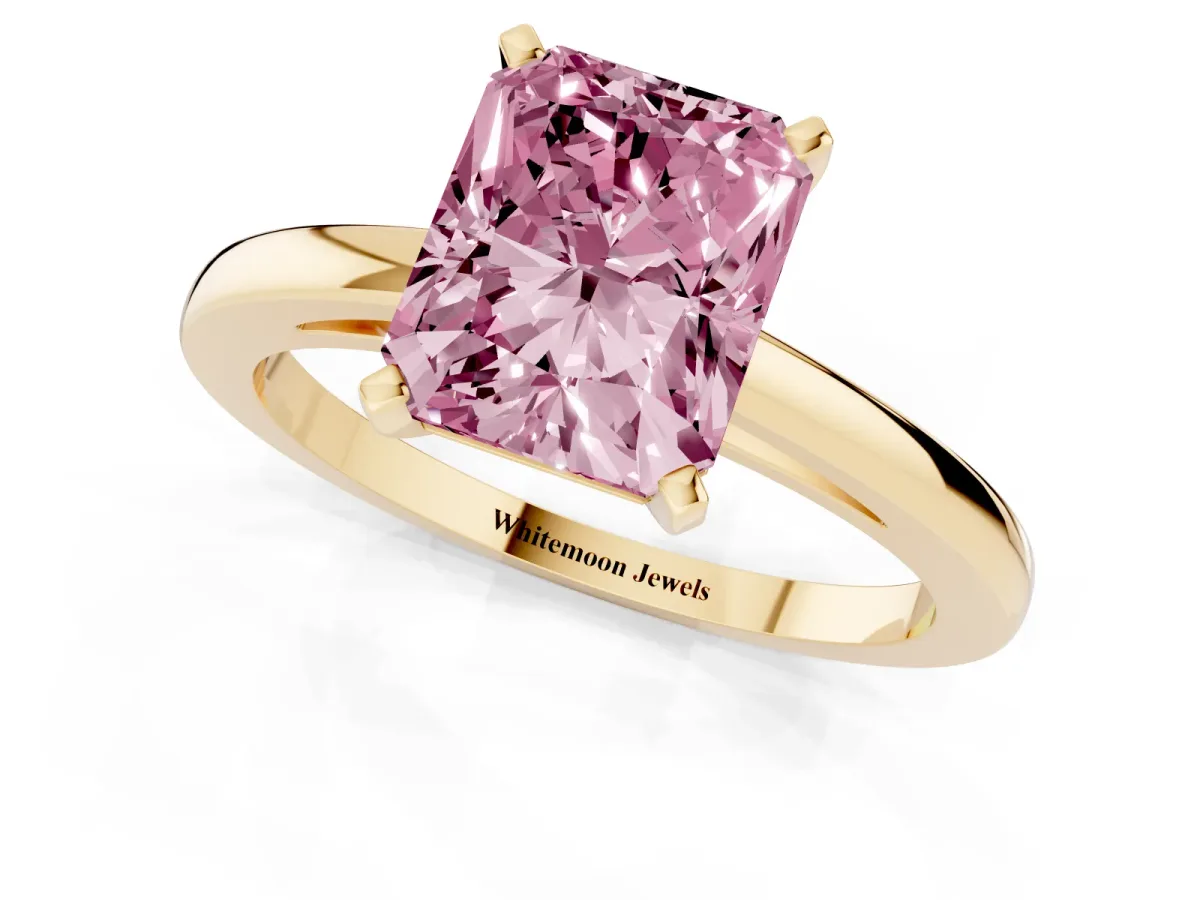 Fancy Pink Radiant Cut Solitaire Diamond Engagement Ring with Four-Prong Setting on a Classic Band Yellow gold