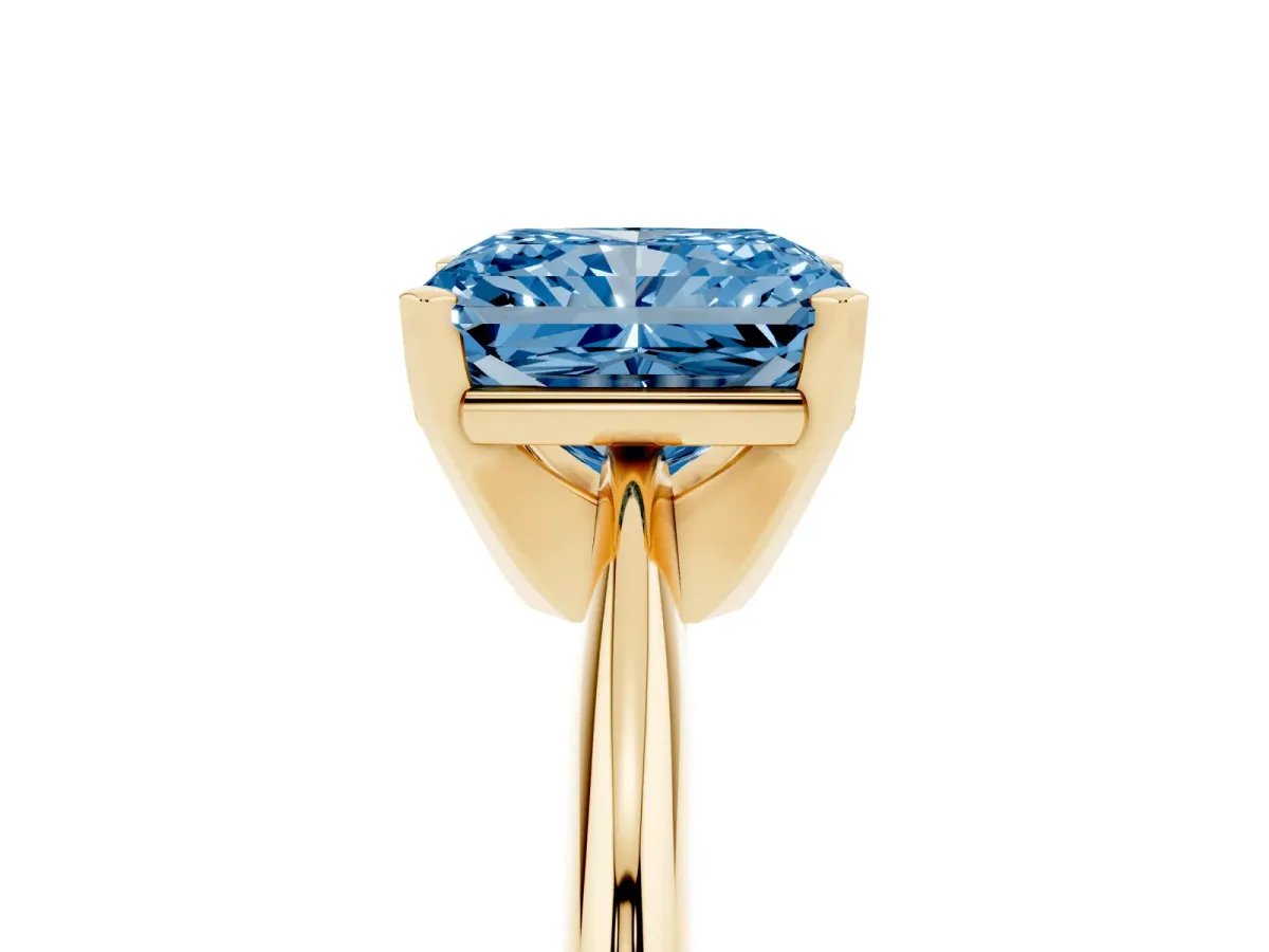 Fancy Blue Radiant Cut Cut Solitaire Ring with Four-Prong Setting on a Classic Band Yellow gold