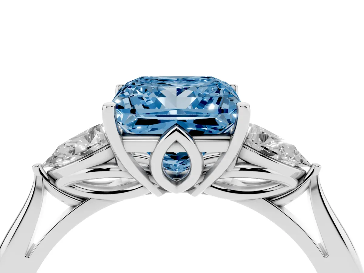 Fancy Blue Three-Stone Princess Cut Diamond Ring with Pear Side Stones in Four-Prong Setting Silver