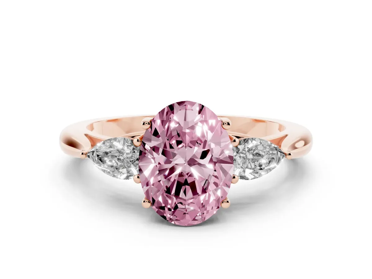 Fancy Pink Three-Stone Oval Cut Diamond Ring with Pear Side Stones in Four-Prong Setting Rose gold