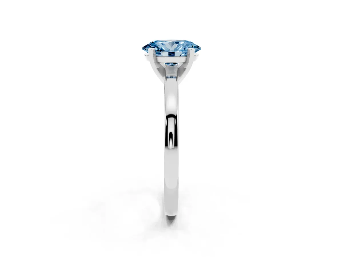 Fancy Blue Oval Cut Solitaire Diamond Engagement Ring with Four-Prong Setting on a Classic Band Silver