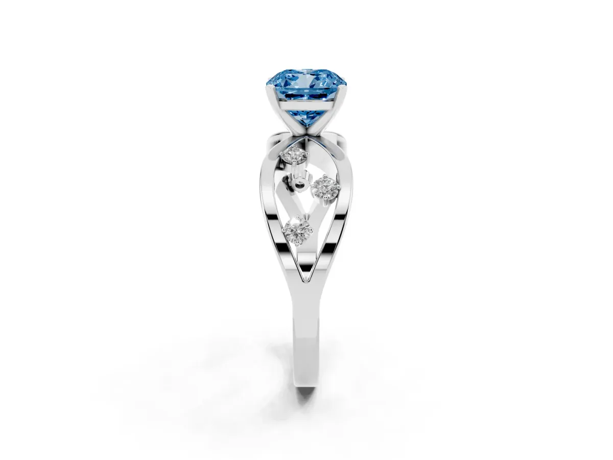 Fancy Blue Cushion Cut Cut Solitaire Diamond with Side Stones on Criss-Cross Band and Four-Prong Setting Silver