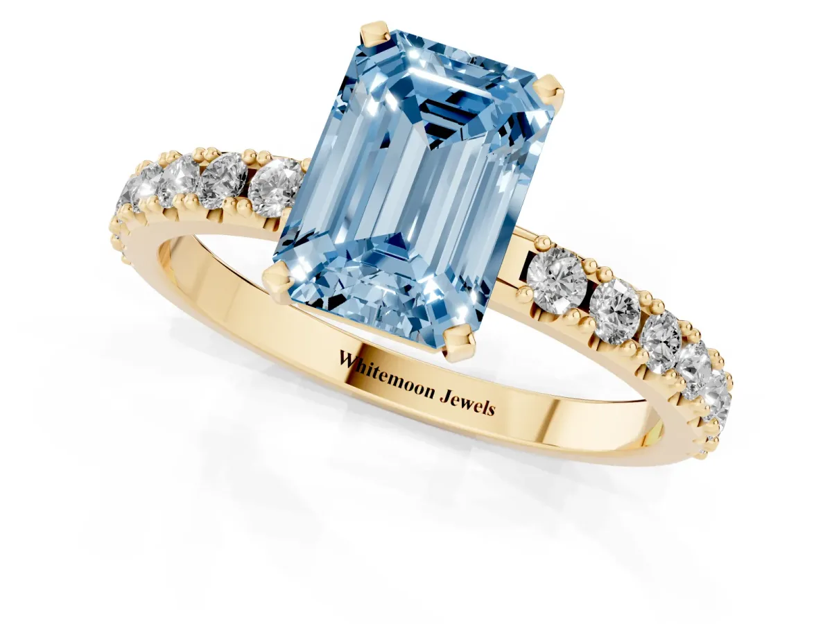 Fancy Blue Emerald Cut Diamond Solitaire Pavé Band with Four-Prong Setting Yellow gold