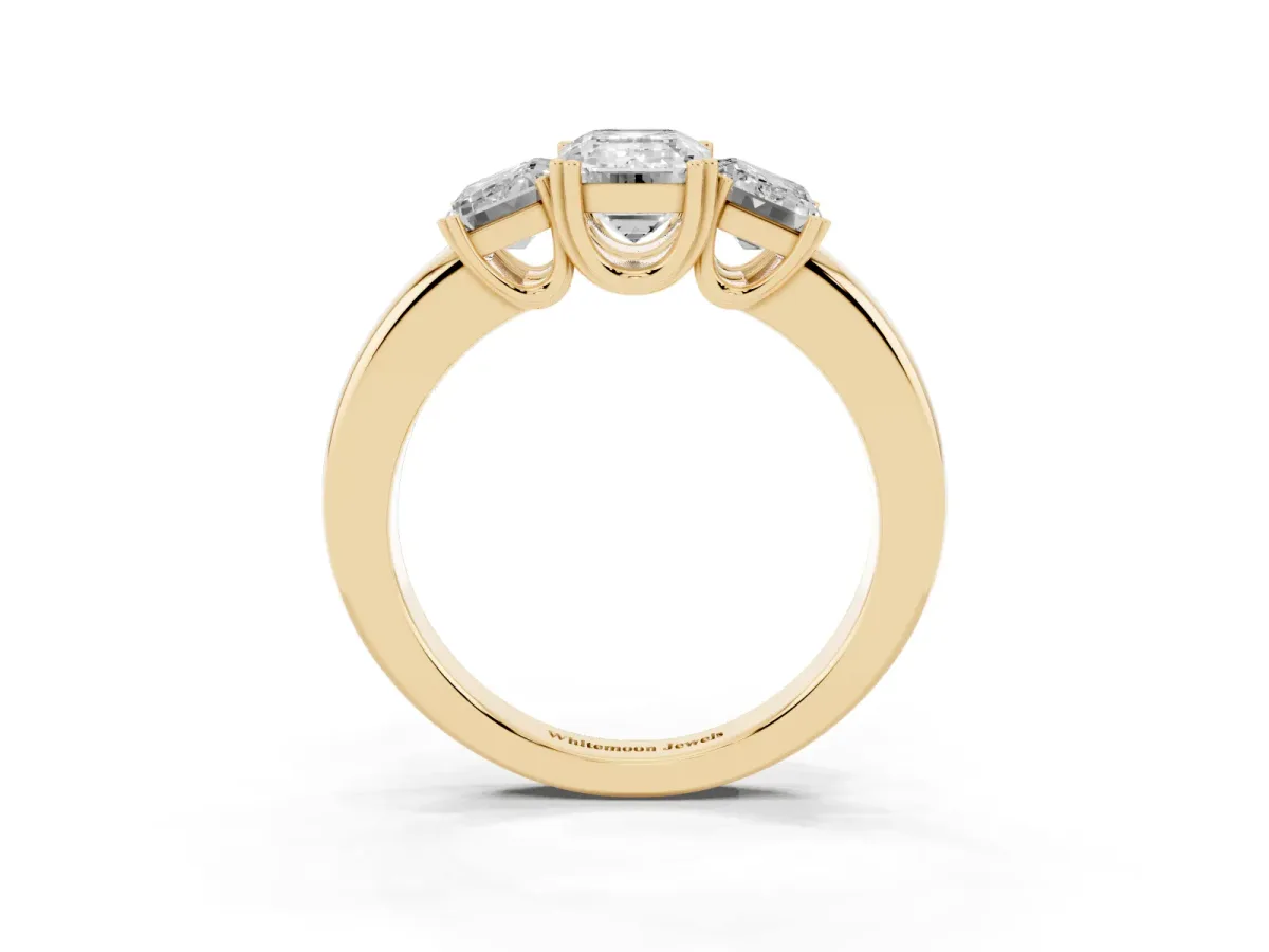 Three-Stone Emerald Cut Cut Diamond Ring with Channel Set Band and Four-Prong Setting Yellow gold