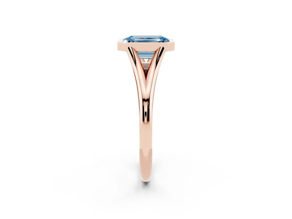 Fancy Blue Bezel Set Emerald Cut Cut Solitaire Ring with Tapered Band Rose gold