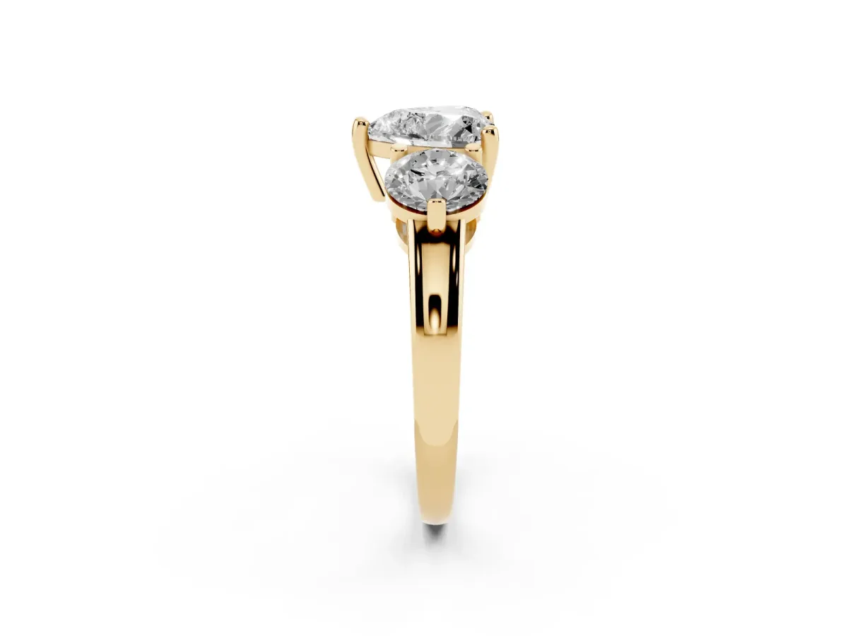 Three-Stone Heart Cut Brilliant Cut Solitaire Ring with Prong Setting on a Classic Band Yellow gold