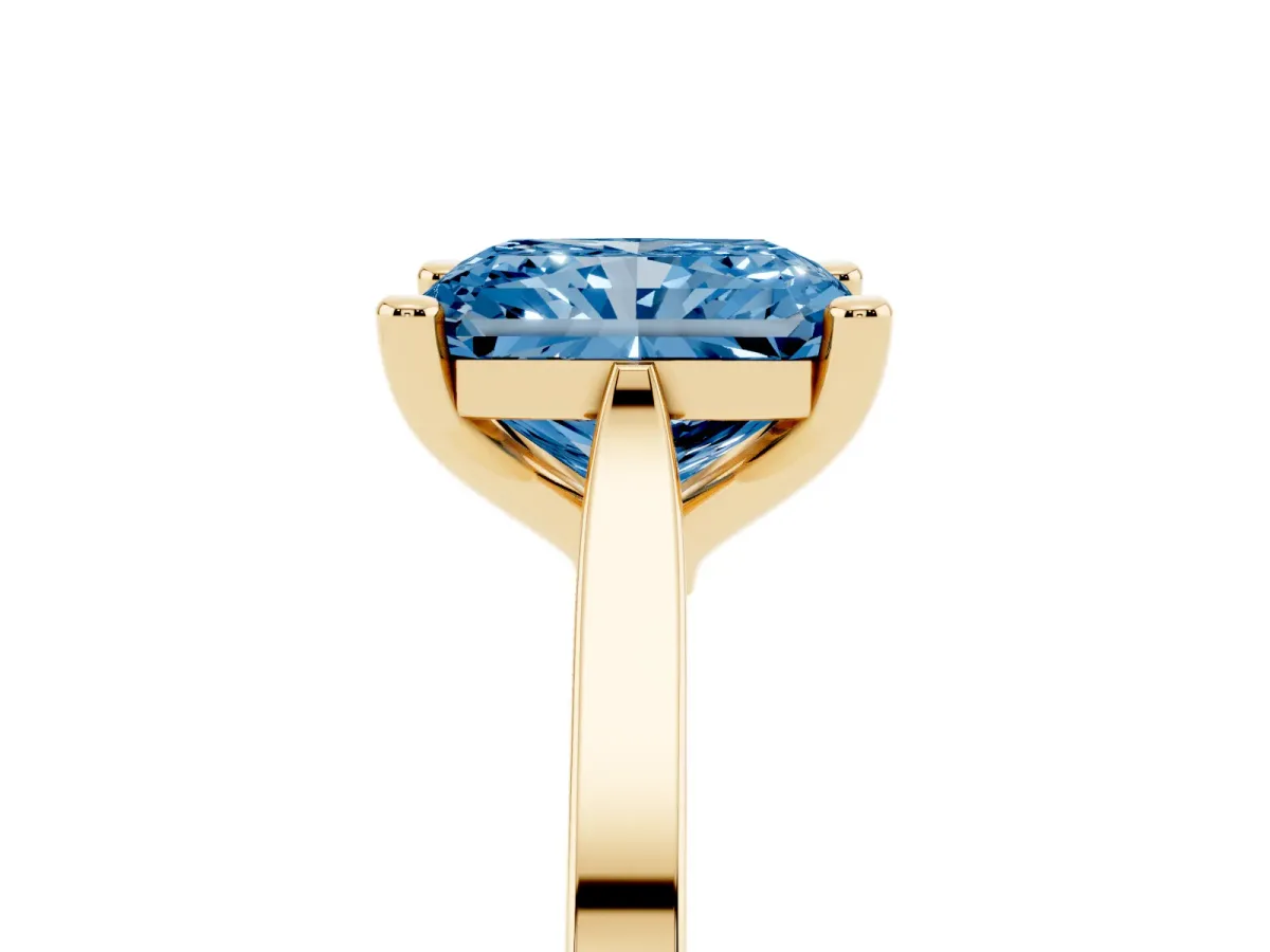 Fancy Blue Radiant Cut Solitaire Diamond Ring with Four-Prong Setting and Tapered Band Yellow gold