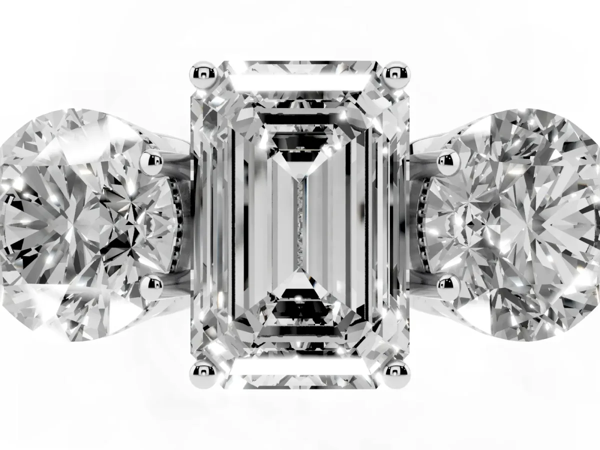 Three-Stone Emerald Cut Diamond Engagement Ring with Prong Setting on a Classic Band Platinum