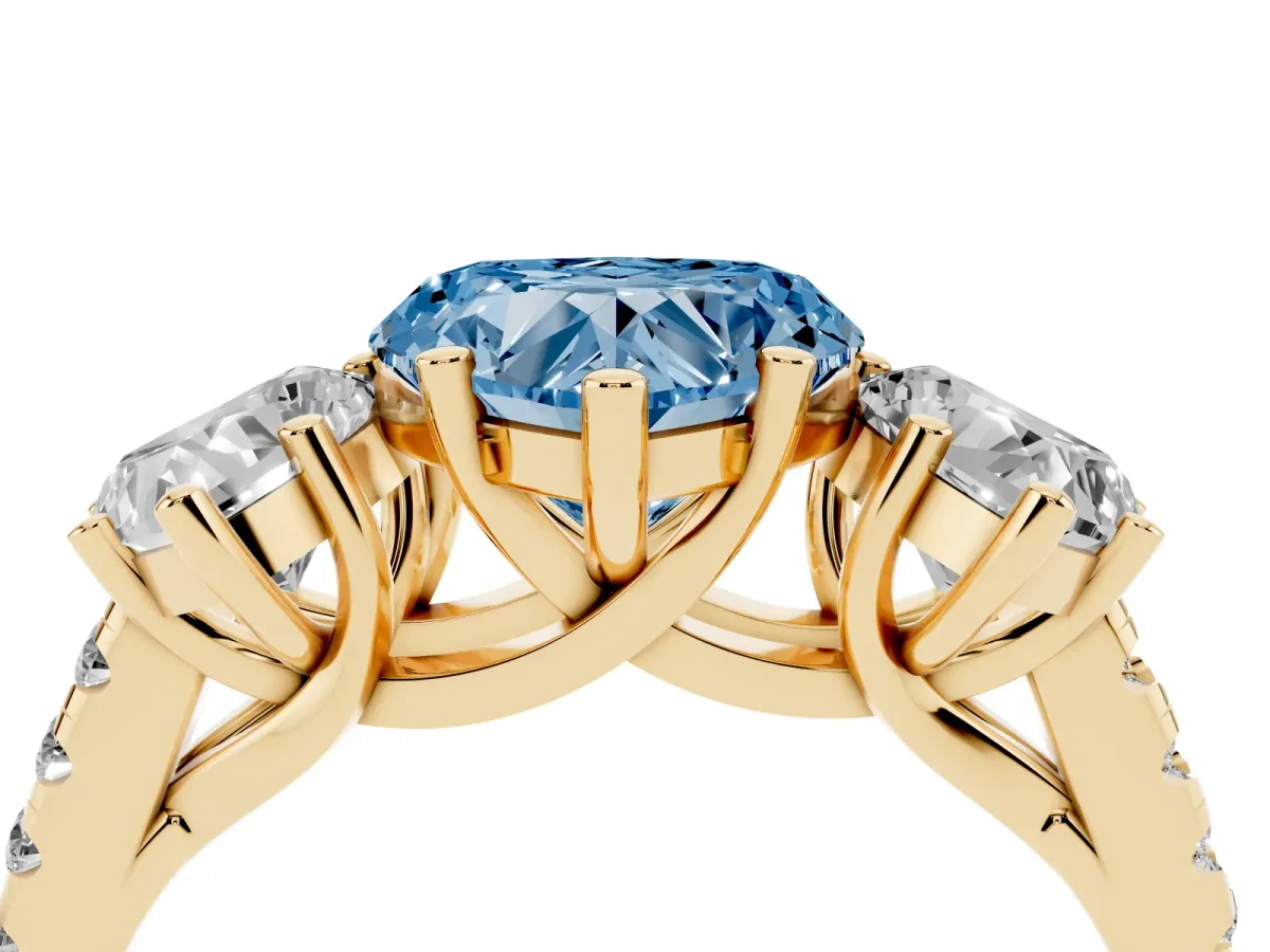 Fancy Blue Three-Stone Heart Cut Diamond Ring with Round Pavé Band and Prong Setting Yellow gold