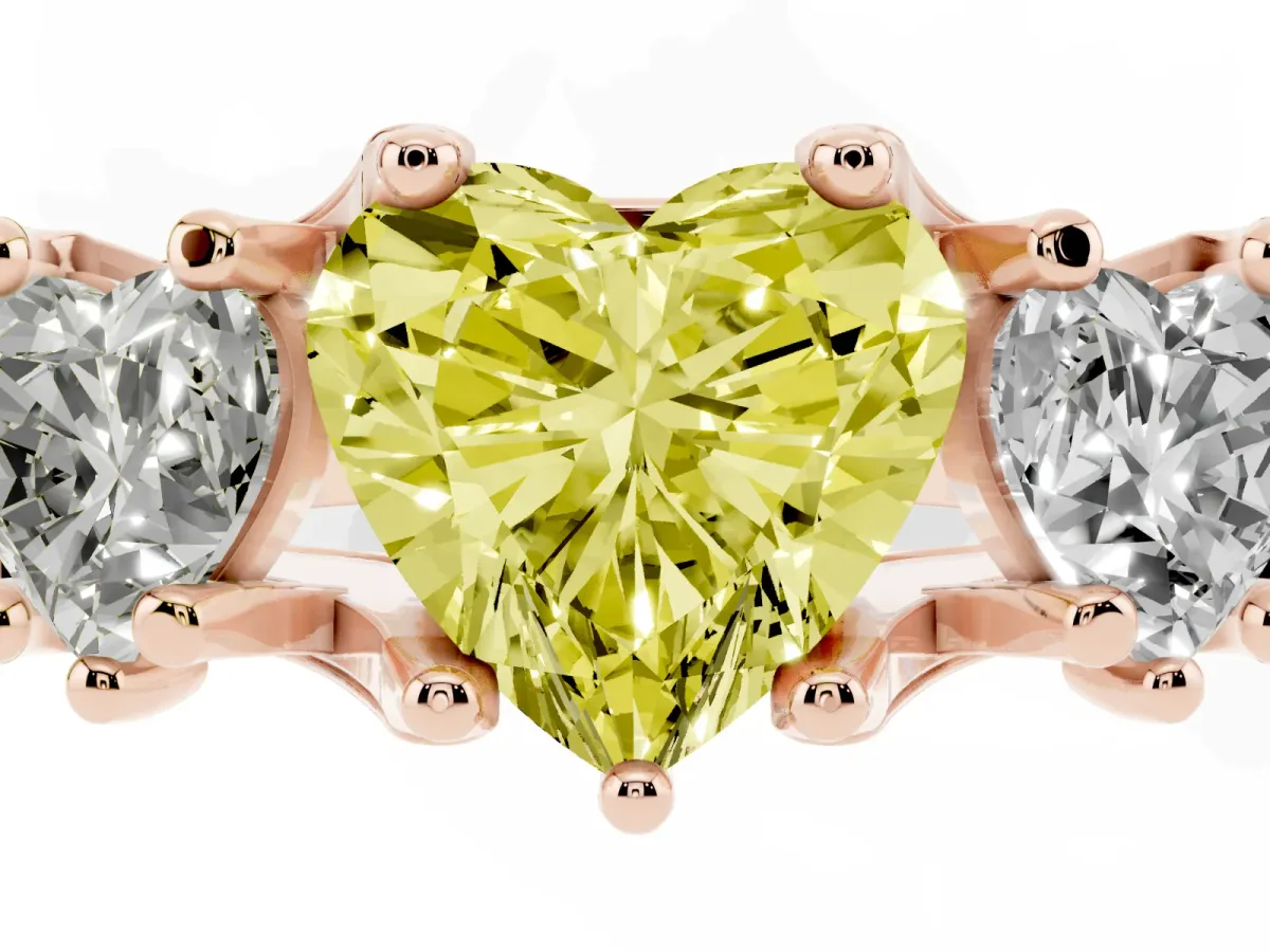 Fancy Yellow Heart Cut Diamond Three-Stone Ring with Channel Set Band and Four-Prong Setting Rose gold