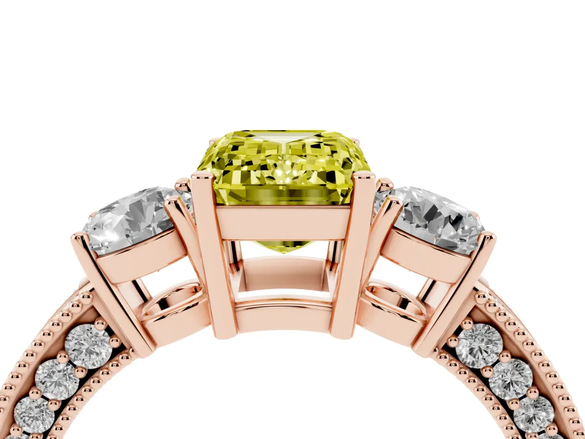 Fancy Yellow Emerald Cut Three-Stone Diamond Ring with Pavé Band and Four-Prong Setting Rose gold