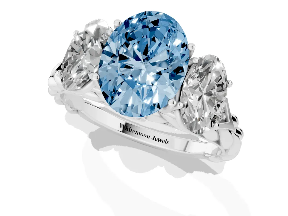 Fancy Blue Three-Stone Oval Cut Diamond Braided Band Ring with Four-Prong Setting Platinum