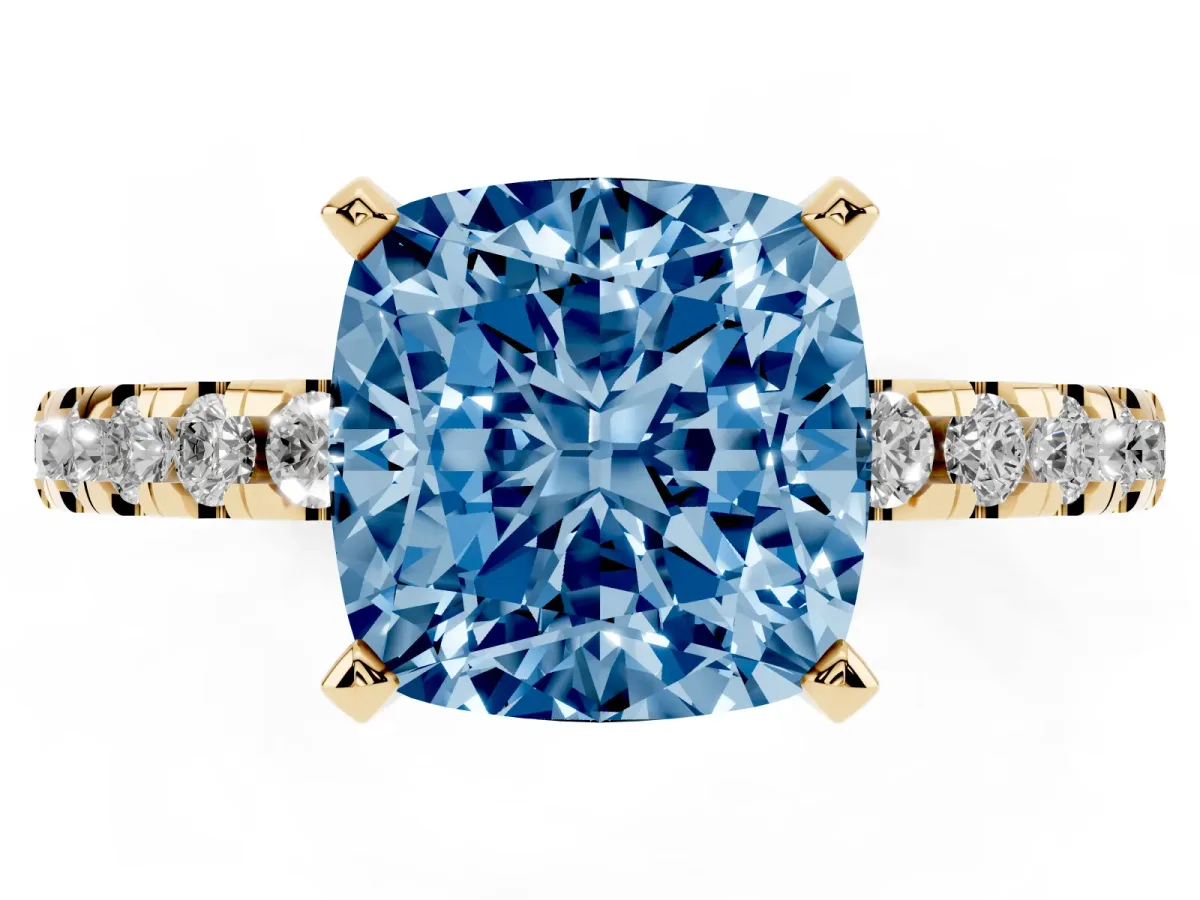 Fancy Blue Cushion Cut Diamond Solitaire Ring with Round Pavé Band and Four-Prong Setting Yellow gold