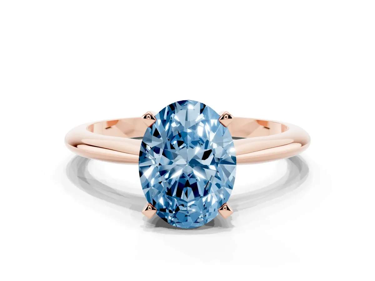 Fancy Blue Oval Cut Cut Solitaire Ring with Four-Prong Setting on a Classic Band Rose gold