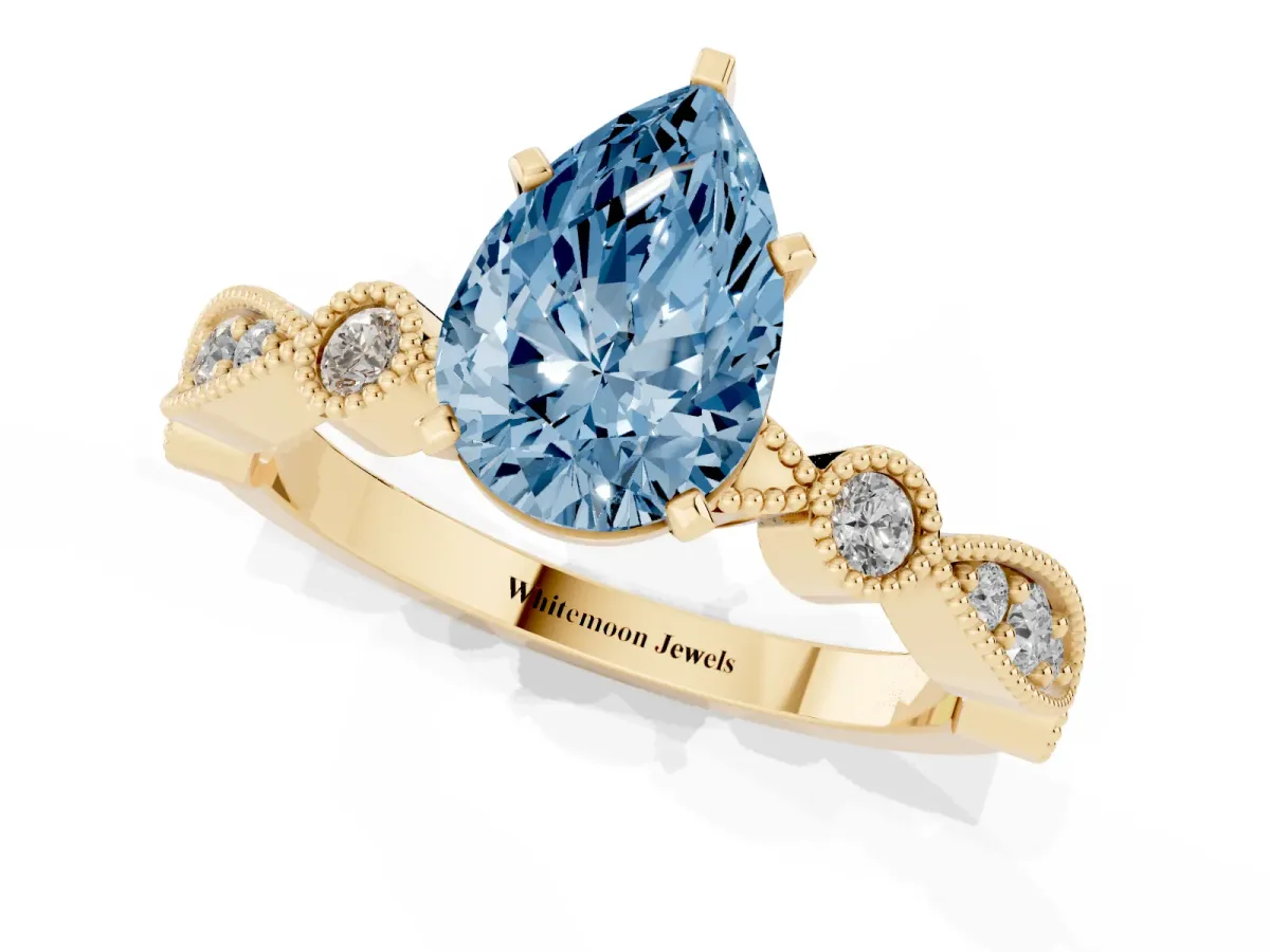 Fancy Blue Pear Cut Milgrain Bezel Diamond Engagement Ring with Solitaire Prong Setting Yellow gold