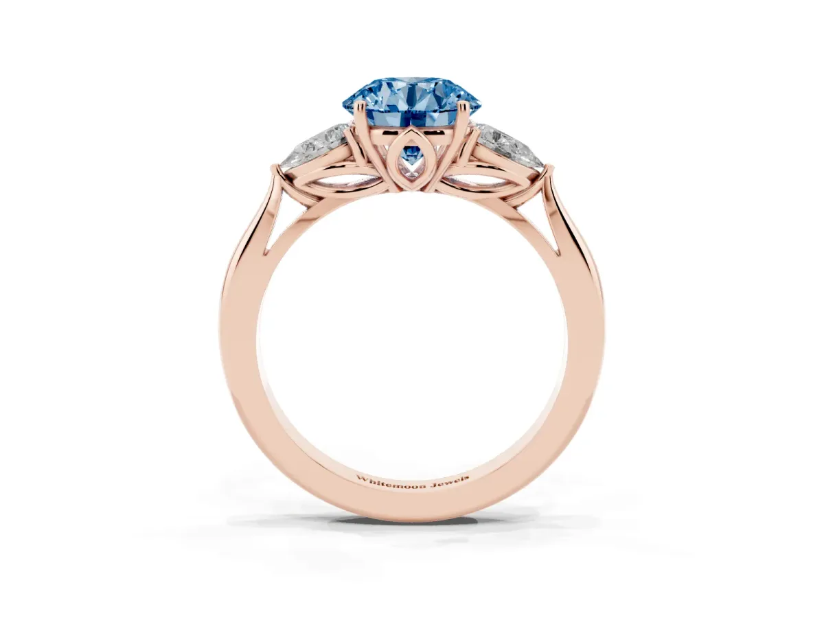 Fancy Blue Three-Stone Round Cut Diamond Ring with Pear Side Stones in Four-Prong Setting Rose gold