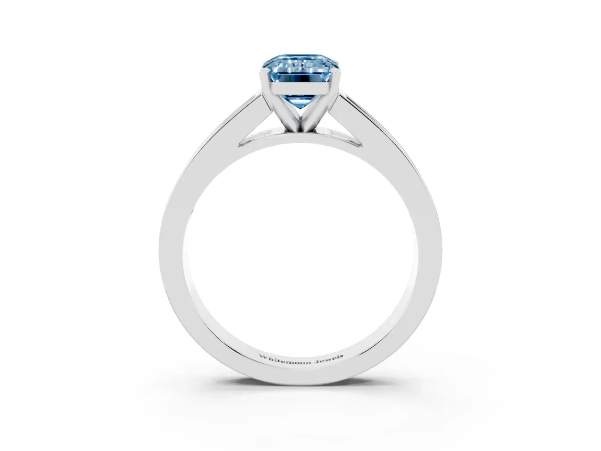 Fancy Blue Emerald Cut Solitaire Diamond Ring with Channel-Set Band and Four-Prong Setting Silver