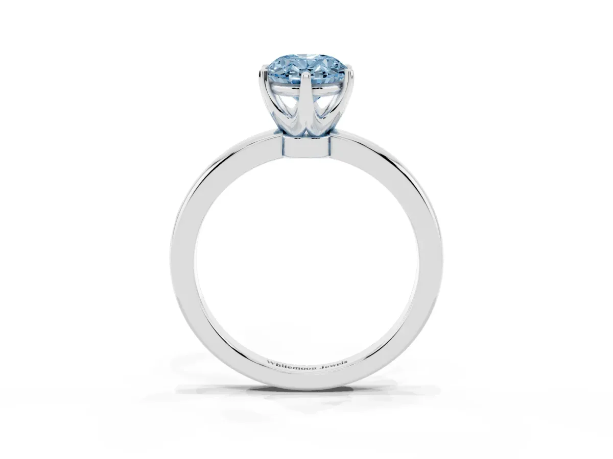 Fancy Blue Oval Cut Solitaire Diamond Ring with Six-Prong Setting on a Classic Band Silver