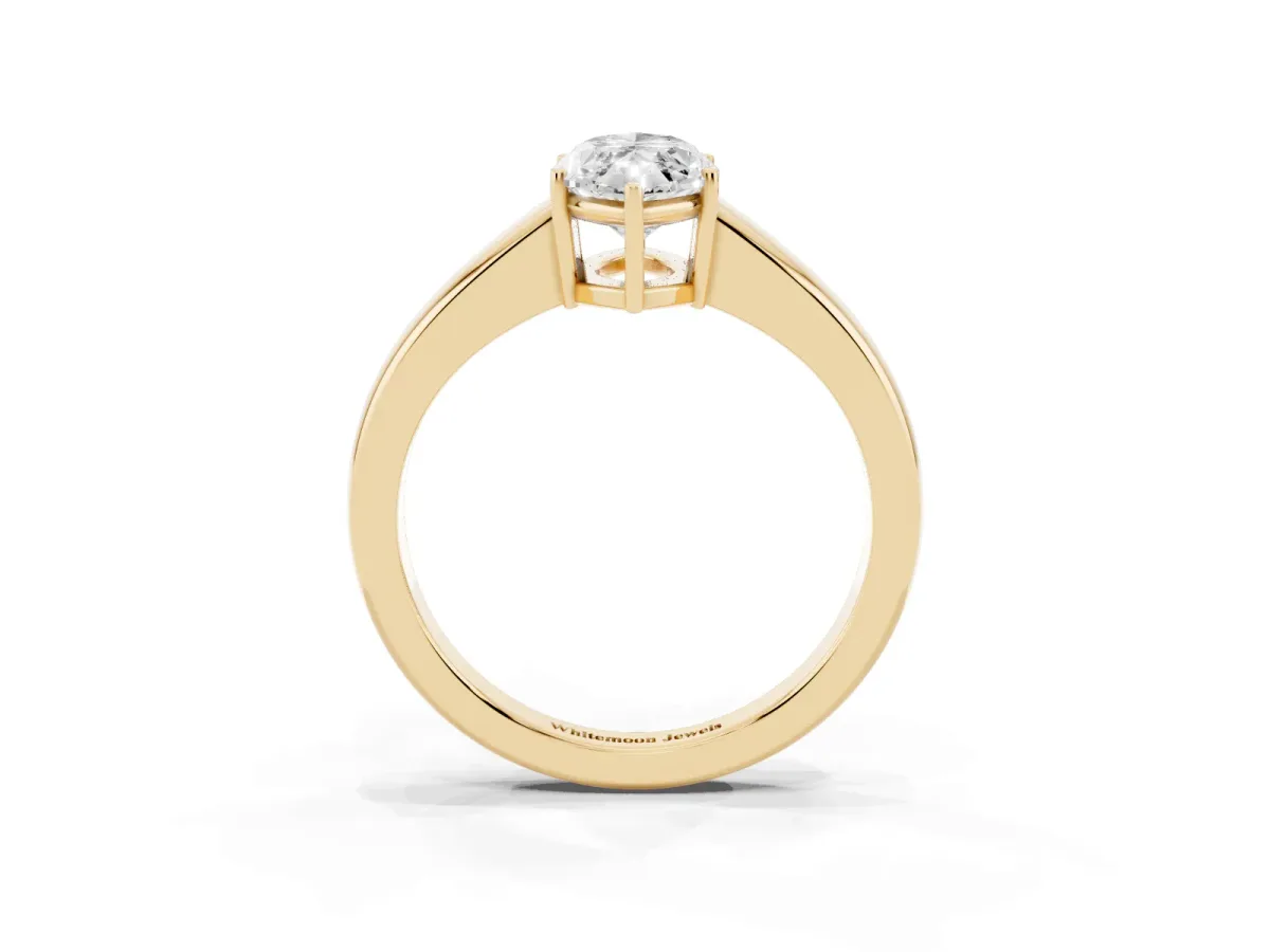 Marquise Cut Solitaire Diamond Ring with Tapered Band and Four-Prong Setting Yellow gold