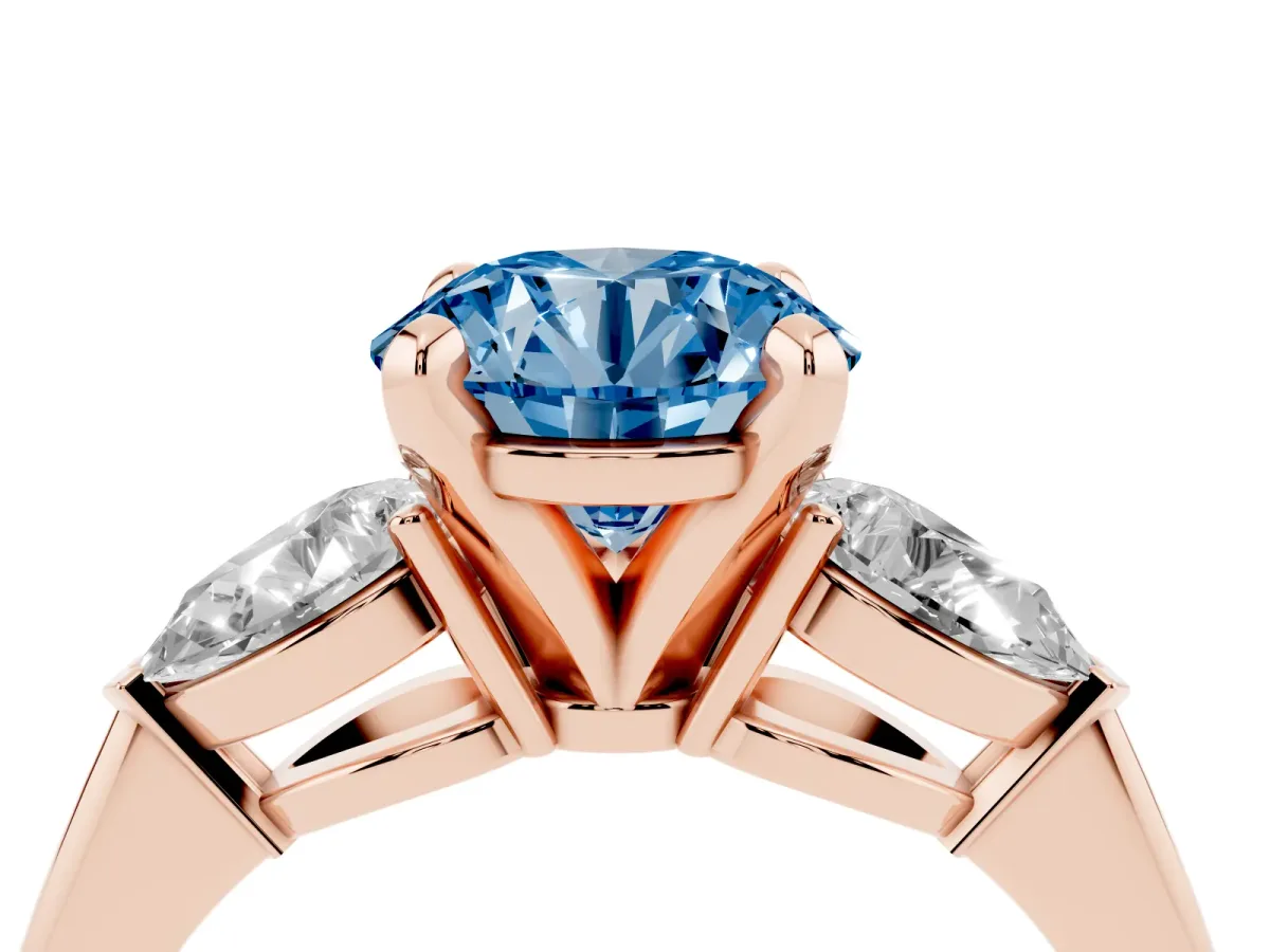 Fancy Blue Three-Stone Round Cut Diamond Ring with Pear Side Stones and Four-Prong Setting Rose gold