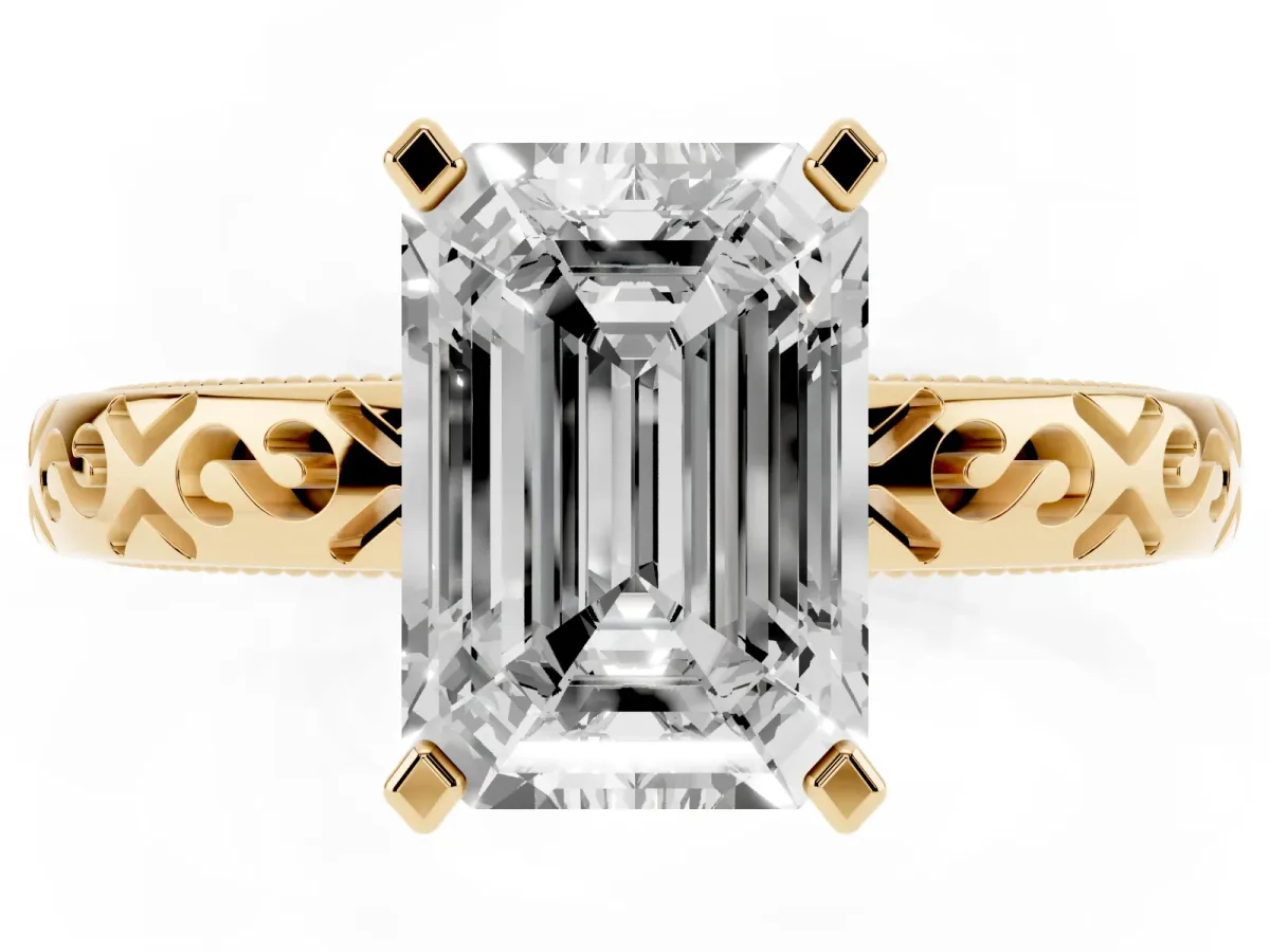 Emerald Cut Solitaire Engagement Ring with Scrollwork Band and Four-Prong Setting Yellow gold