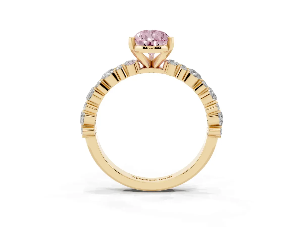 Fancy Pink Pear Cut Diamond Side Stone Solitaire Ring with Round and Four-Prong Setting Yellow gold