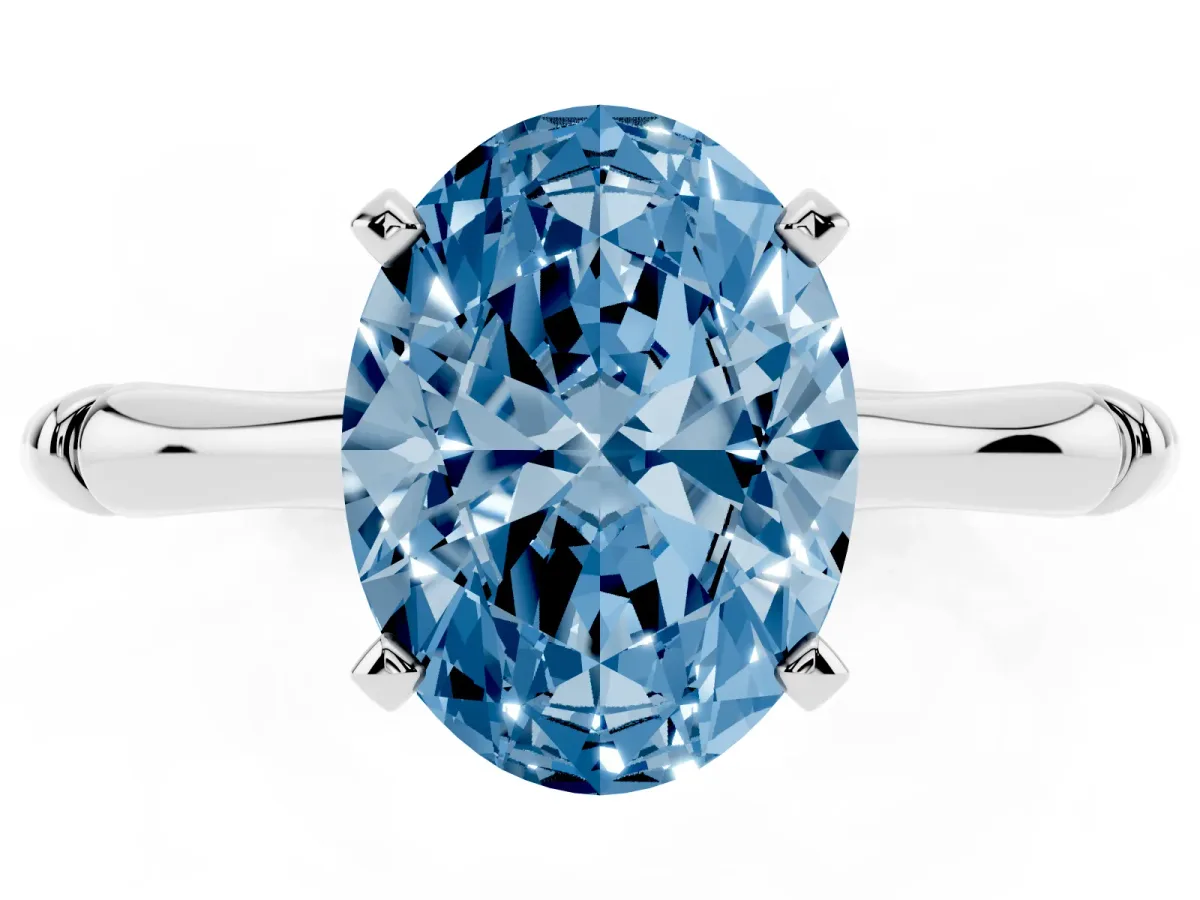 Fancy Blue Oval Cut Solitaire Diamond Ring with Bamboo Band and Four-Prong Setting Silver
