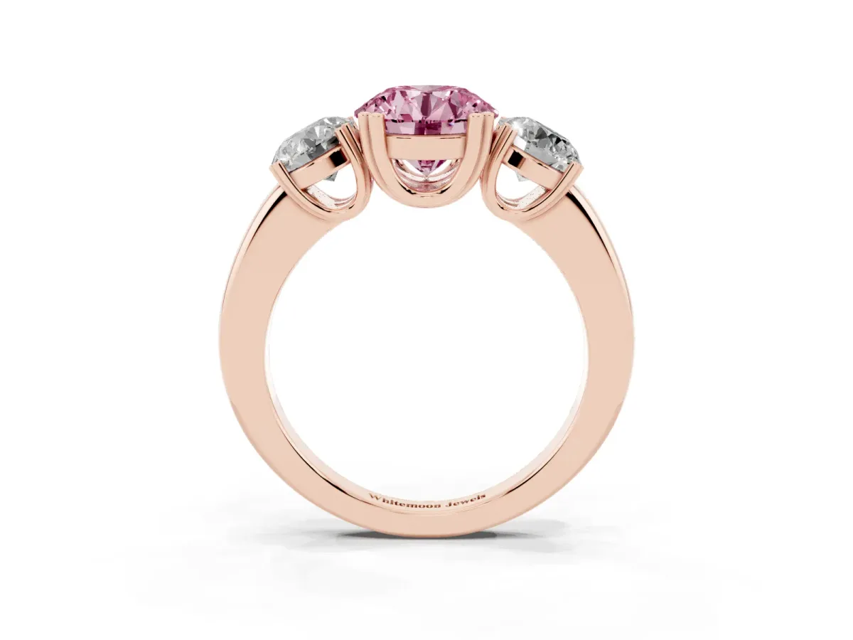 Fancy Pink Three-Stone Round Cut Cut Diamond Ring with Channel Set Band and Four-Prong Setting Rose gold