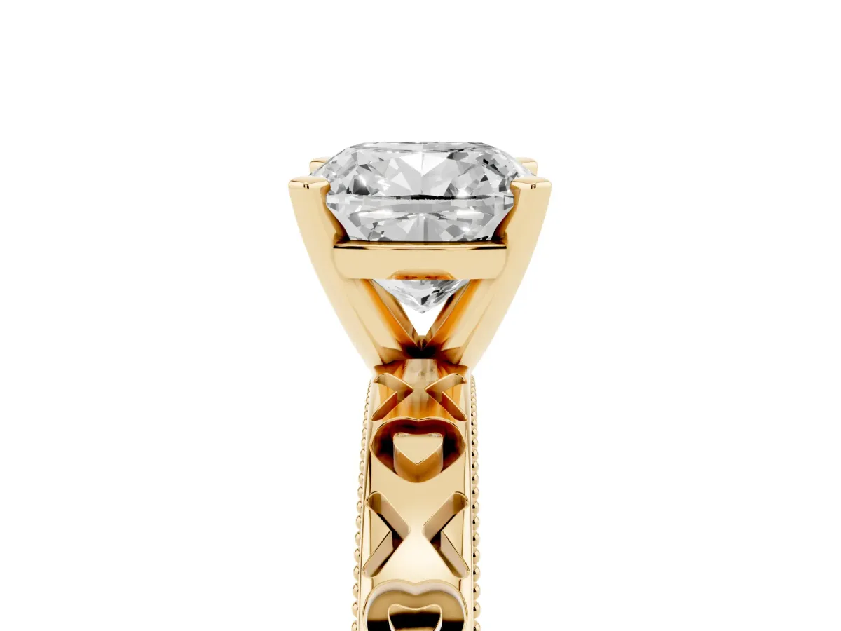 Cushion Cut Solitaire Diamond Engagement Ring with XO Engraved Band and Four-Prong Setting Yellow gold