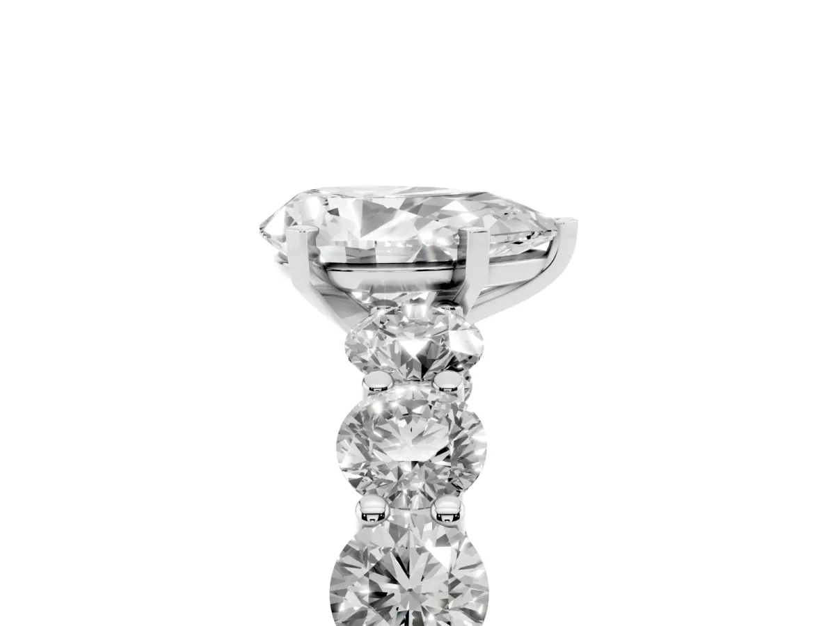 Pear Cut Diamond Prong Setting with Side Stones on a Pave Band Silver