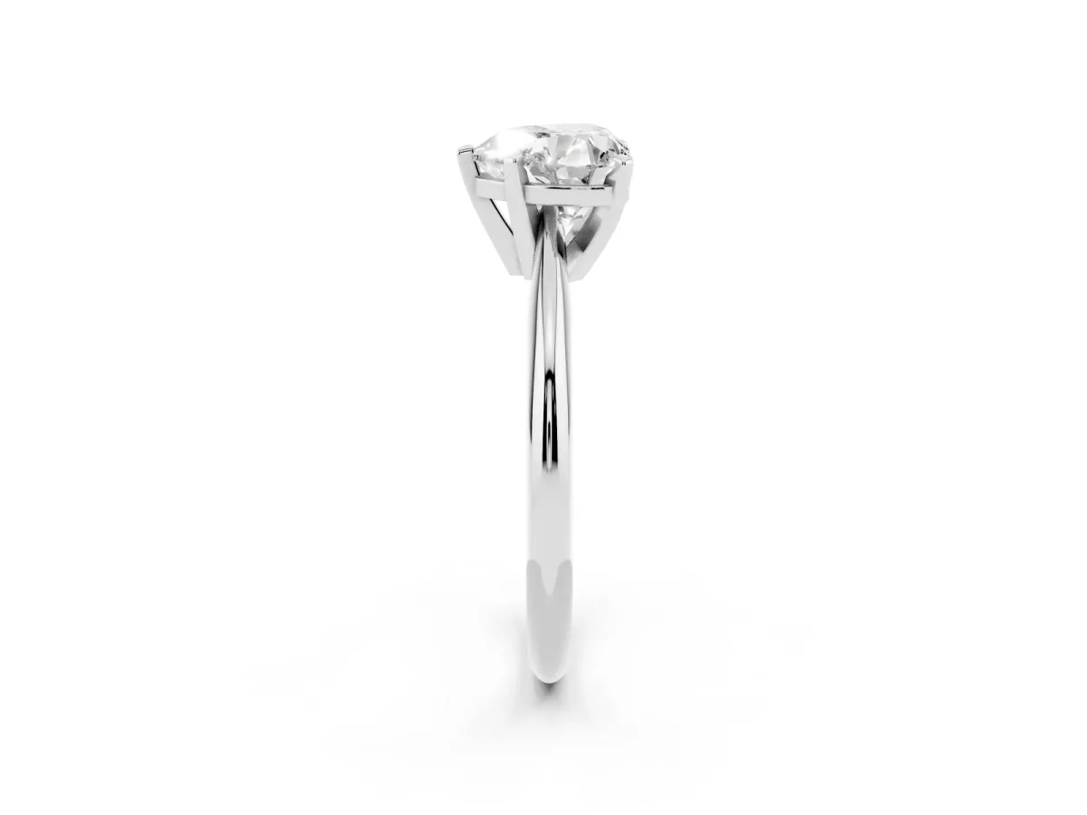 Heart Cut Cut Solitaire Ring with Four-Prong Setting on a Classic Band Silver