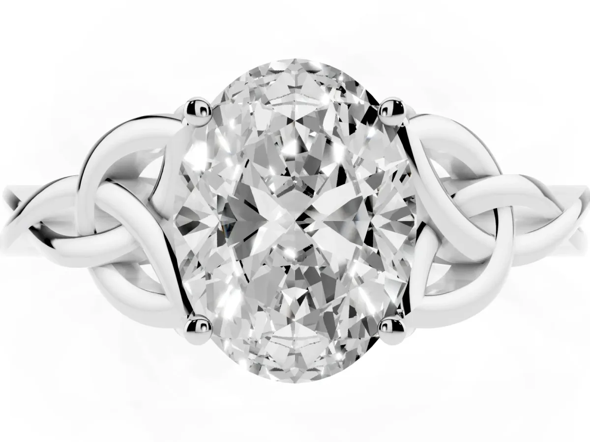 Oval Cut Diamond Solitaire Engagement Ring with Celtic Knot Band and Four-Prong Setting White gold