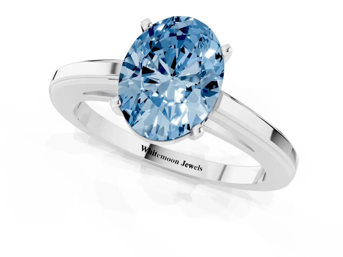 Fancy Blue Oval Cut Solitaire Diamond Ring with Four-Prong Setting and Classic Band White gold