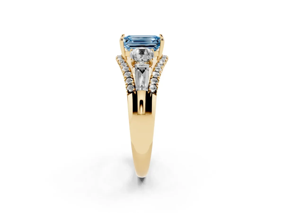 Fancy Blue Three-Stone Emerald Cut Diamond Engagement Ring with Pave Band and Prong Setting Yellow gold