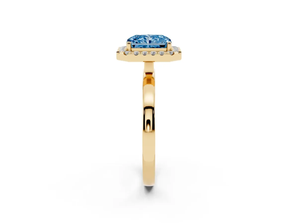Fancy Blue Radiant Cut Halo Diamond Solitaire with Pavé Band and Four-Prong Setting Yellow gold