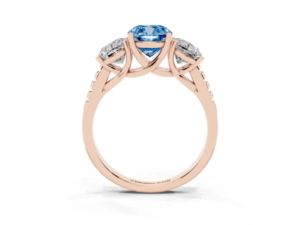 Fancy Blue Three-Stone Cushion Cut Diamond Ring with Round Pavé Band and Prong Setting Rose gold