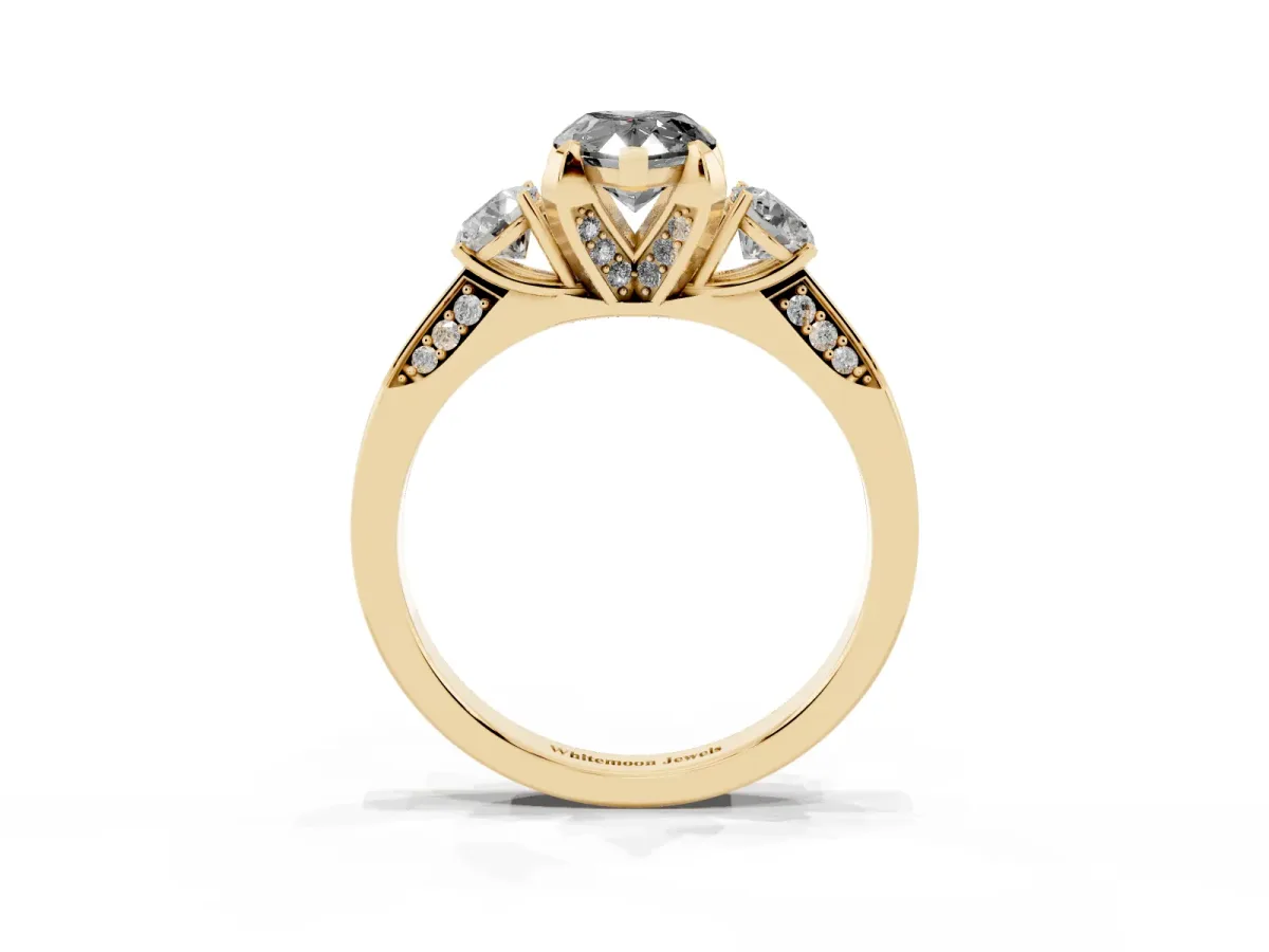 Fancy Black Pear Cut Brilliant Three-Stone Diamond Ring with Pavé Band and Four-Prong Setting Yellow gold