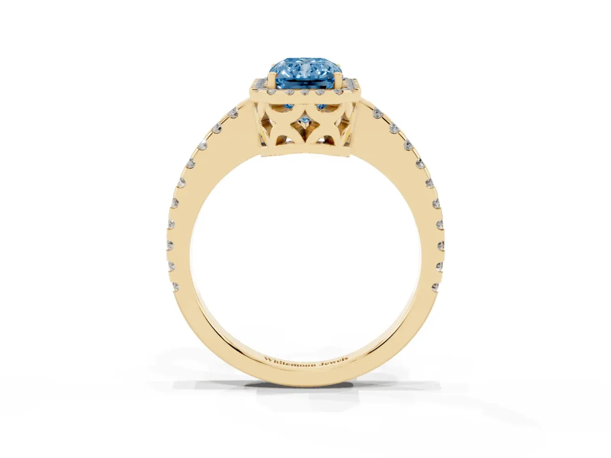 Fancy Blue Radiant Cut Diamond Halo Engagement Ring with Pavé Band and Prong Setting Yellow gold