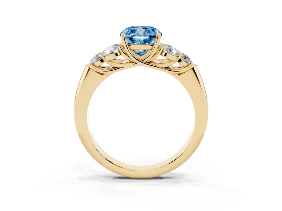 Fancy Blue Cushion Cut Cut Diamond Cluster Ring with Round Accent Stones and Prong Setting on a Classic Band Yellow gold