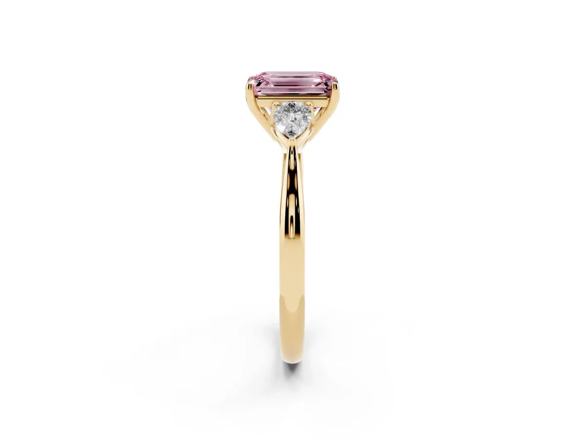 Fancy Pink Emerald Cut Diamond Three-Stone Ring with Pear Side Stones and Prong Setting Yellow gold