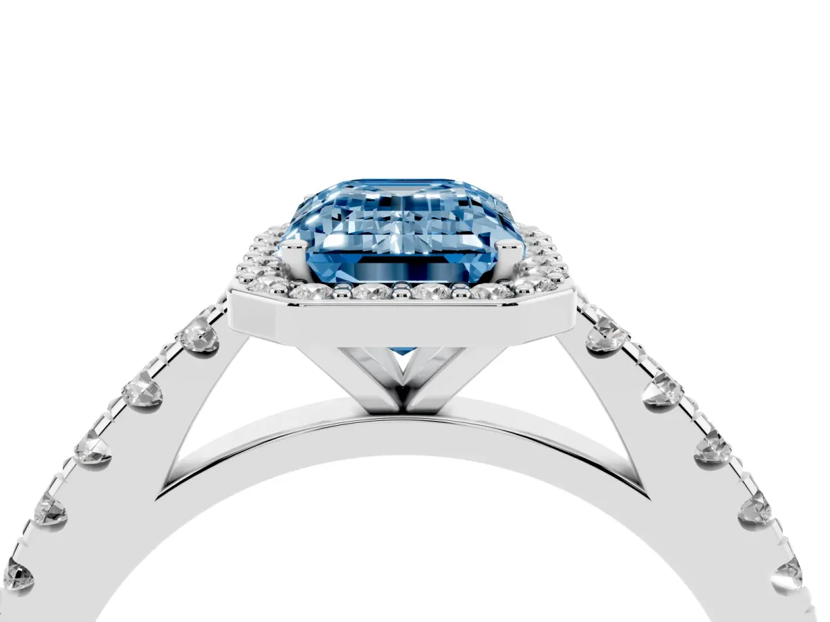 Fancy Blue Emerald Cut Cut Halo Diamond Engagement Ring with Pave Band and Four-Prong Setting White gold
