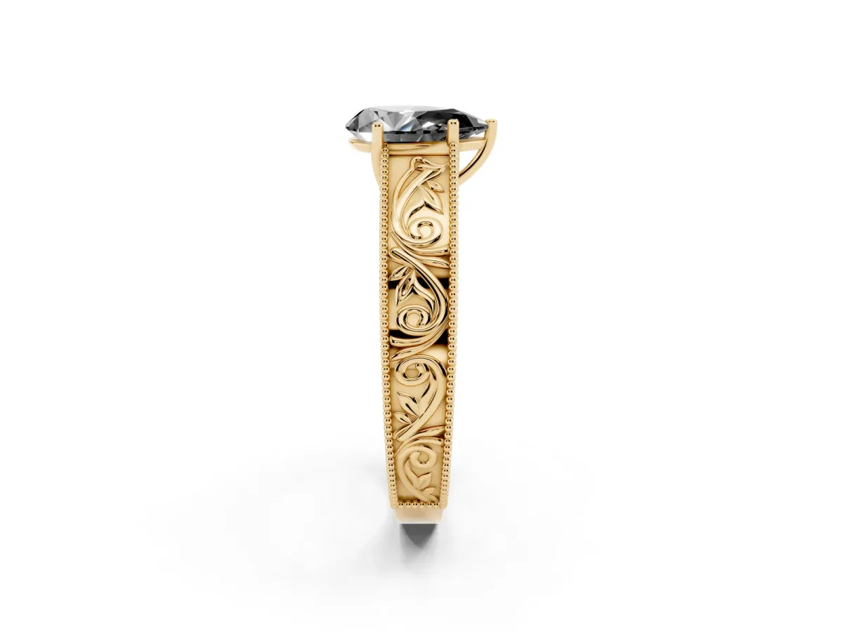 Fancy Black Pear Cut Diamond Solitaire Ring with Engraved Band and Four-Prong Setting Yellow gold