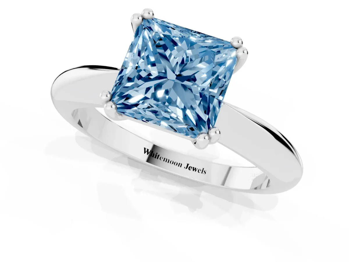 Fancy Blue Princess Cut Cut Solitaire Engagement Ring with Tapered Band and Four-Prong Setting Platinum