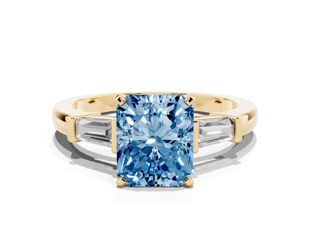 Fancy Blue Radiant Cut Cut Diamond Solitaire Ring with Tapered Baguette Accents and Four-Prong Setting Yellow gold